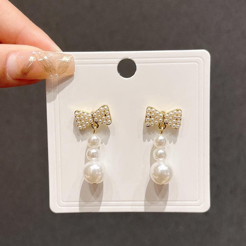S925 Silver Needle Sweet Versatile Unique Imitation Pearl Bow Stud Earrings Trendy Niche Design Sense Premium Earrings