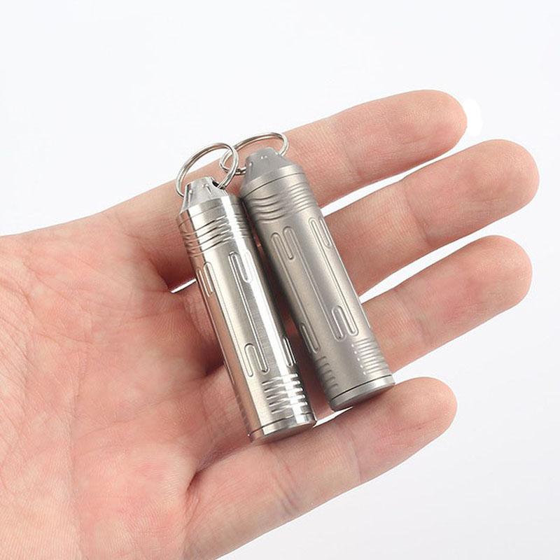 Versiegelte Kapsel aus Titanlegierung mit Halskette Wasserdichte Pillendose Outdoor Zuhause Erste-Hilfe-Anhänger Überlebensflasche Behälter