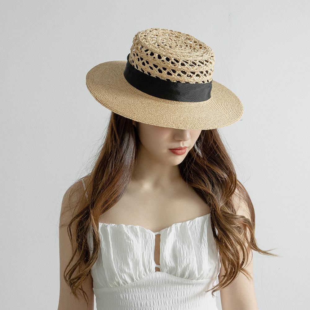 Spring and summer new fashion casual webbing bow hand-woven hollow splicing raffia flat top hat sunshade straw hat tide