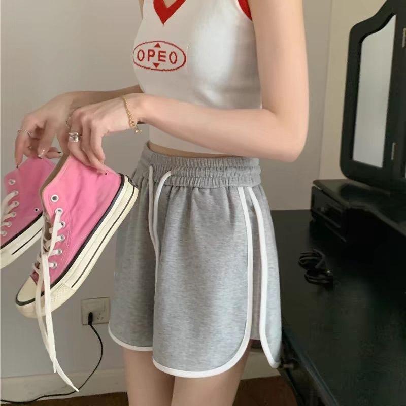 

Лето 2024 Женские шорты средней посадки свободного кроя для спорта - Однотонные с широкими штанинами, стройнящий дизайн Medium серый