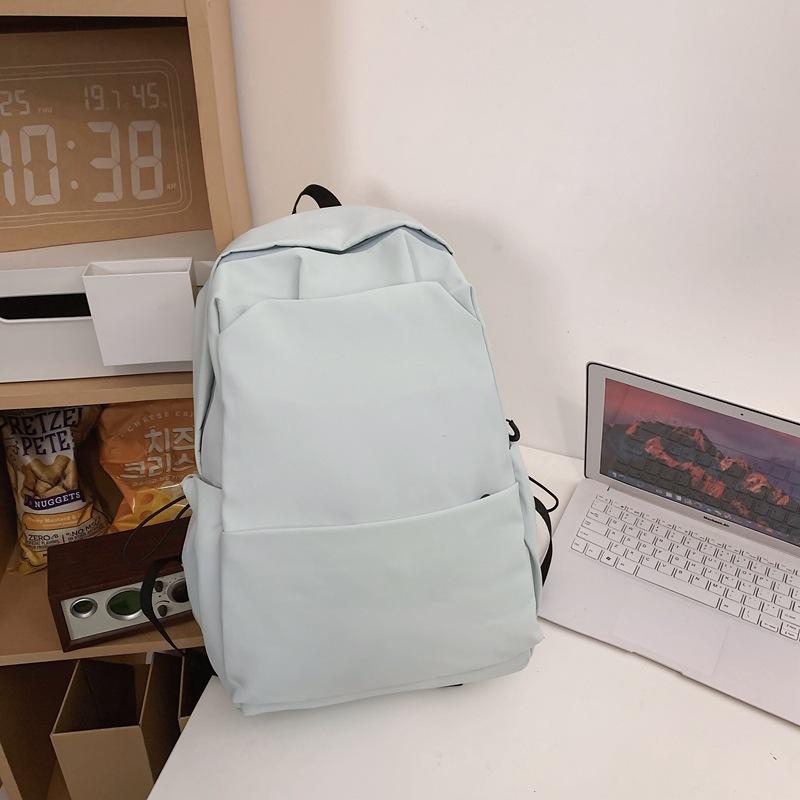 Schoolbag new large-capacity high-value junior high school student casual schoolbag Japanese and Korean version solid color fashionable simple