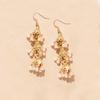 Pair Of Alloy Made Bohemian Style Dangling Earrings With Three Layer Hollow Out Bell Tassels For Versatile Outfits And Special Event