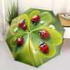 A Compact Folding Umbrella Featuring Ladybugs On a Backdrop of Green Leaves, Perfect for Gifting On Any Occasion.