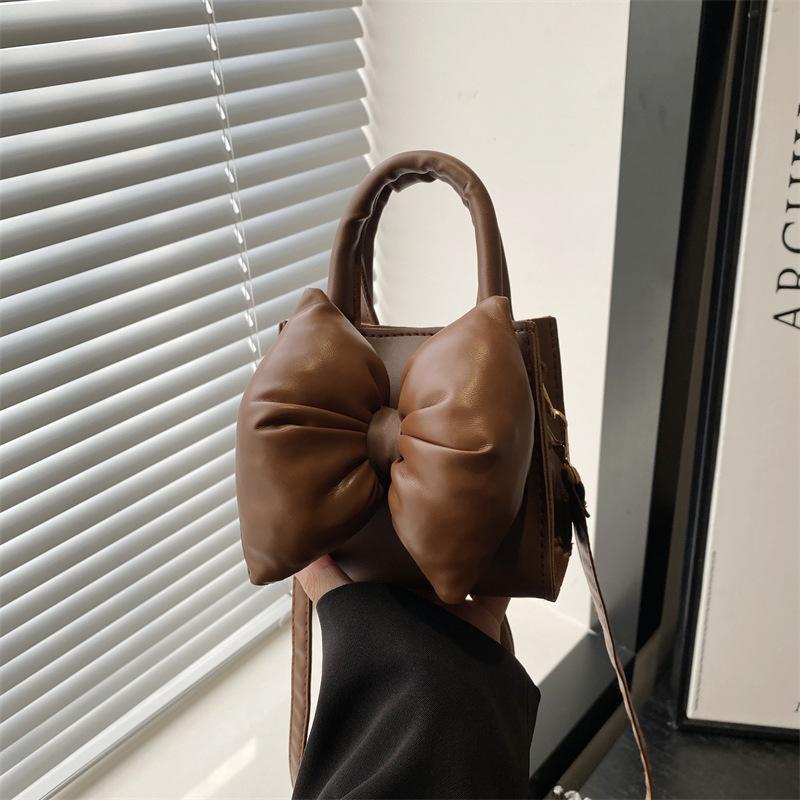 Niche bow solid color new mini hand carry small square bag summer beautiful retro shoulder messenger bag women