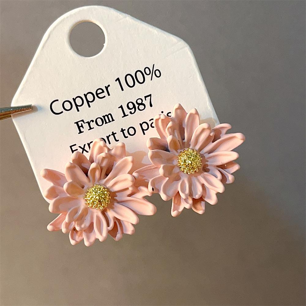 Boucles d'oreilles bohèmes roses à fleurs de perles de rocaille et pompons de perles