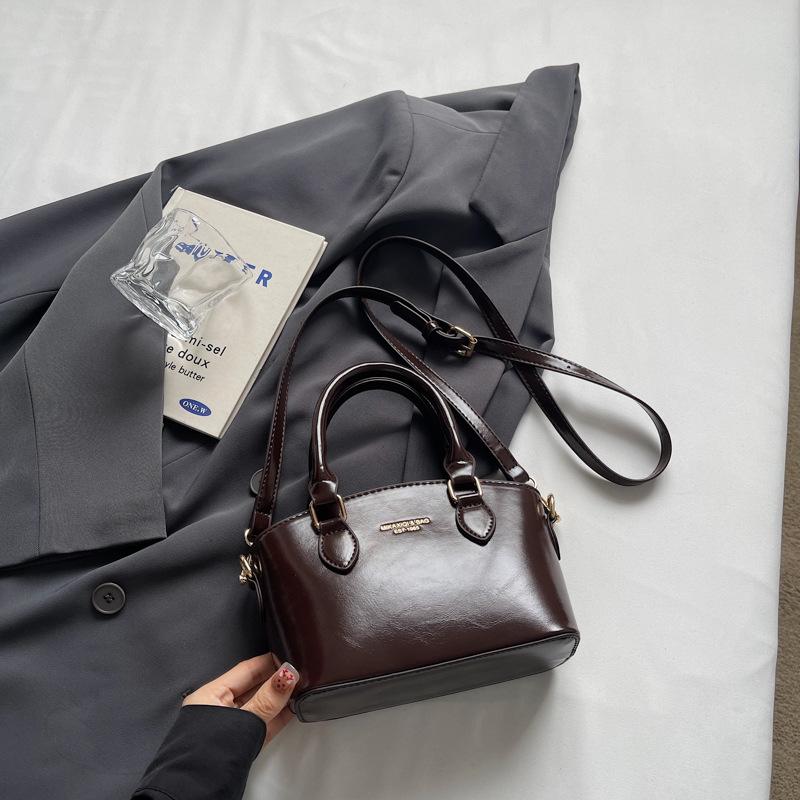 

Премиальная текстура маленькая сумка женская новая портативная сумка-ведро нишевый дизайн легкая роскошная сумка через плечо