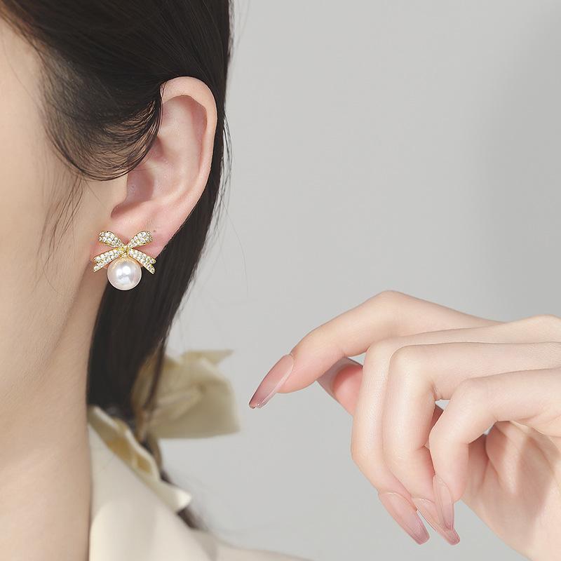 Japan and Korea Exquisite Micro-inlaid Zircon Bow Pearl Stud Earrings Women's Fashion Simple Small Versatile Earrings 2026