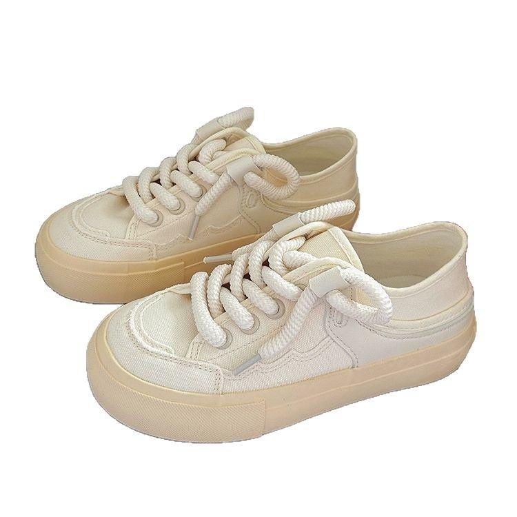 The heel can be stepped on half-towed canvas shoes for women's 2025 spring new niche original versatile little white shoes with skirts for women'