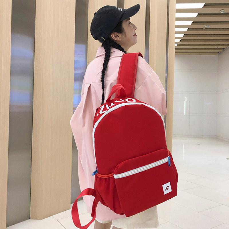 

Backpack, high-value schoolbag for primary school students, contrasting color splicing printing, solid color backpack, new model. червоний