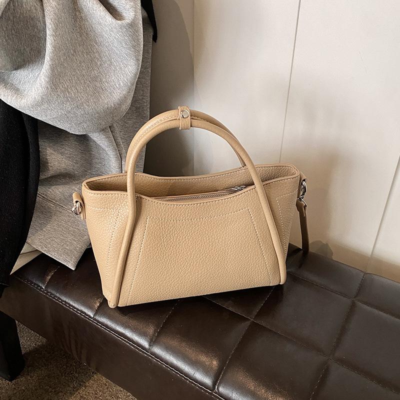 Retro Simple Hand-Carried Bucket Bag Women'S Spring New Niche High-End Shoulder Bag Casual Commuting Versatile Women'S Bag