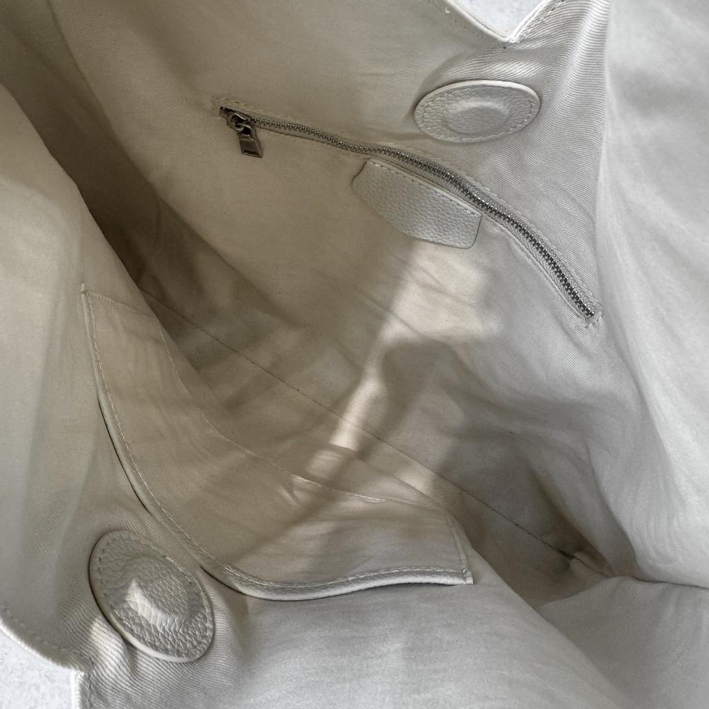 Cross-border first-layer cowhide commuter large-capacity women's bag zipper triangle bag versatile portable shoulder lazy wind underarm bag