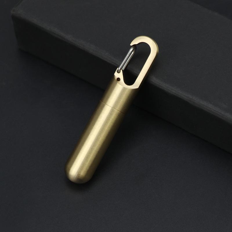 Compact Brass Pill Bottle: Waterproof, Dustproof, Moisture-Proof Storage Jar with Key Hook - Ideal for Travel or Everyday Use.