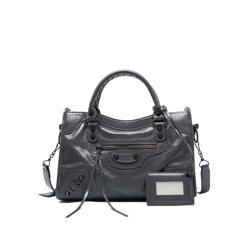 Spice girl rivet locomotive bag retro messenger leather large capacity tote bag niche leather handbag women