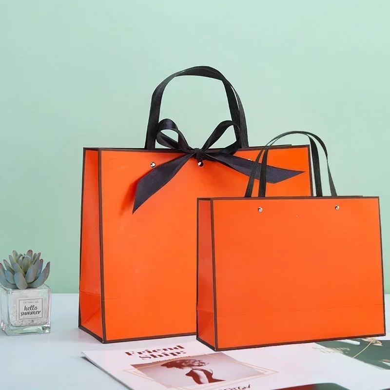 White Paper Jam Handbag Kraft Paper Thick Waterproof Frame Rivet Handle Gift Bag Cosmetic Clothing Store Portable Packaging Bags