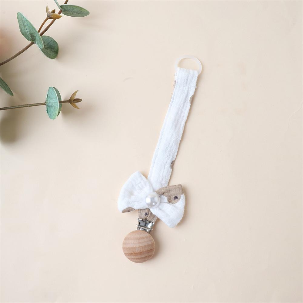 1 Stück Niedlicher Neugeborener Mädchen Schnuller Clip Kette Süße Prinzessin Schleife Schnullerclip Kette Stoff Holz Anti-Verloren Spielzeug Schnullerkette