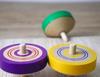 Traditional wooden colored throwing set of 3 toy, tops, (green, yellow, purple)