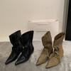 Niche pointed strap loose mouth witch boots spring new big tube circumference small high heel short boots design sense women's boots