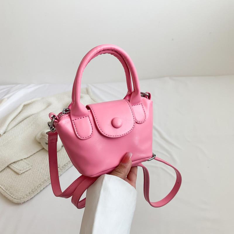 

Trendy Mini Candy Color Pu Leather Handheld Keychain Bag For Girls And Boys With Fashionable Patterns Pink