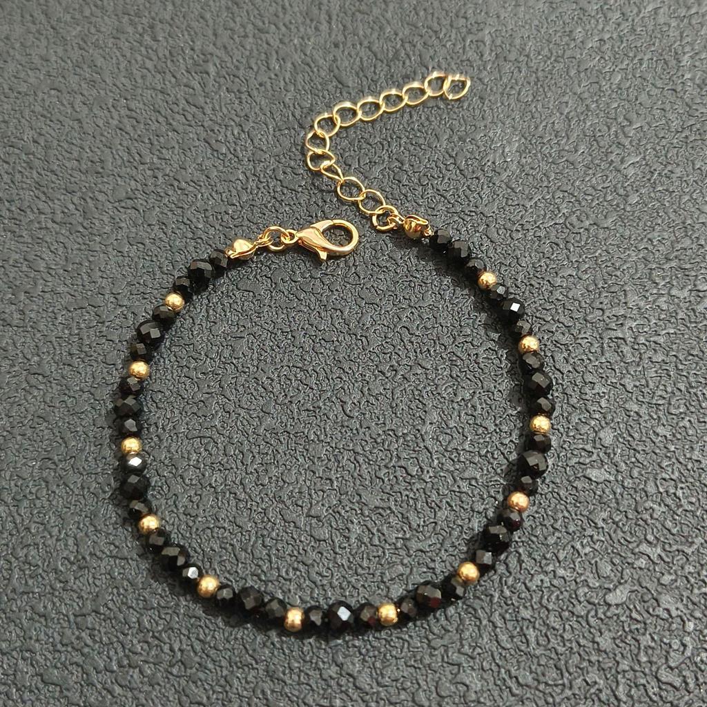 Nouvelle arrivee: Ensemble collier et bracelet faits main en perles de cristal noir pour femmes avec perles dorées - Élégant, Polyvalent, Style Célébrité