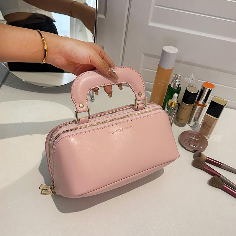 

Новая косметичка для женщин, большая вместимость, модная и высококачественная, ручная сумка для хранения средств по уходу за кожей, туалетная сумка 24x13x14cm розовый