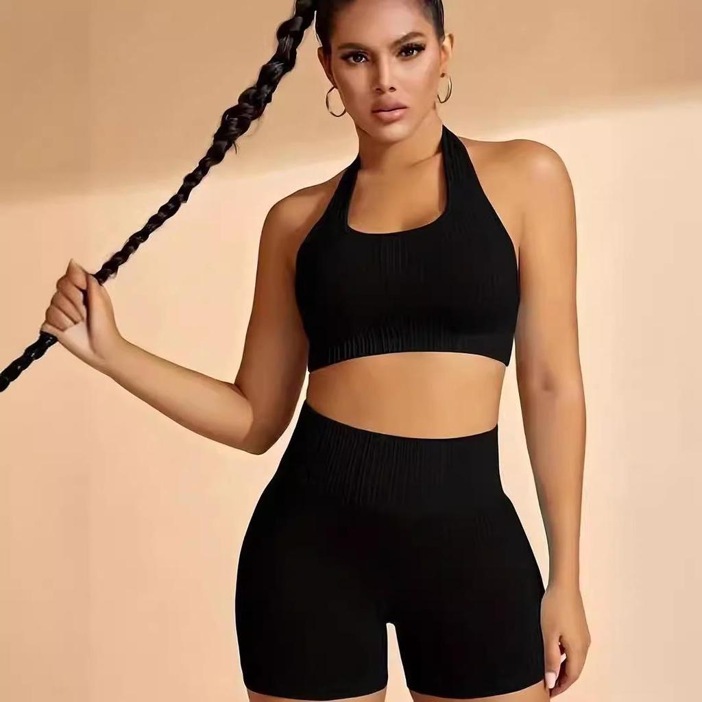 Seamless Knitted Halter Neck Two-Piece Sports Set for Women - Includes Back Detail Short Sleeve Top and Bra with Chest Pads, Plus Shorts.