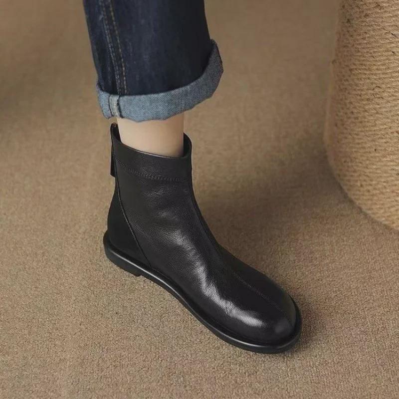 Flache Martin-Stiefel für Damen: Britischer Retro-Stil, Rundkopfnähte, weiches Leder und Sohle, vielseitige Stiefeletten für Herbst und Winter.