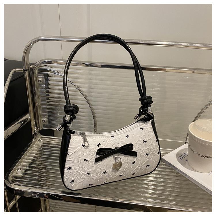 Niche design bow underarm bag women's 2025 new handbag fashion shoulder messenger bag sweet baguette bag