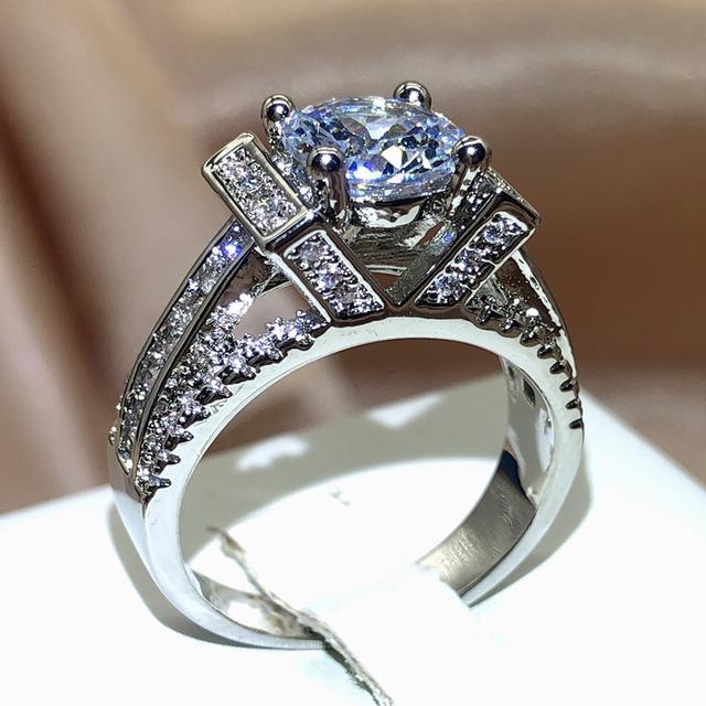 

Высокое качество, уникальный дизайн, V-образное кольцо с инкрустацией в форме сердца и кристаллами, женское обручальное кольцо из оловянного сплава, серебряный цвет, роскошное любовное кольцо 9 белый