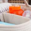Handwoven Rope Organizer Basket with Dividers. Versatile storage for diapers, toys, laundry. Portable for any room.