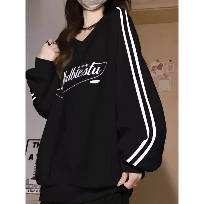 Bluza damska w paski z dekoltem w serek - Kolekcja Wiosna/Jesień 2024