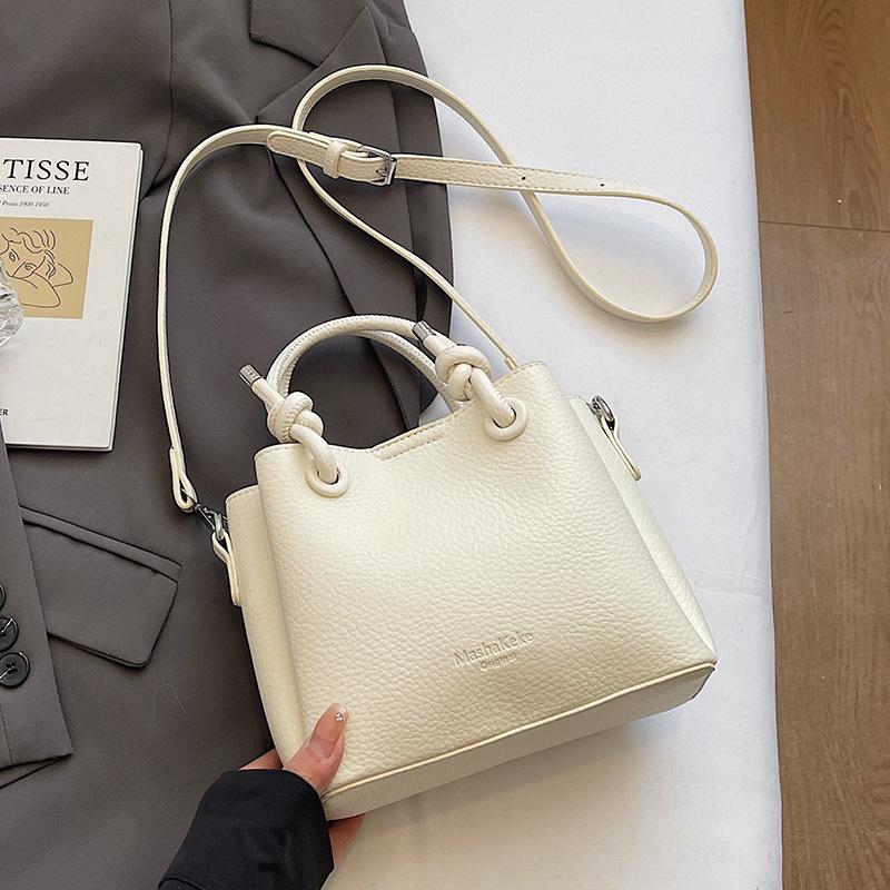 New trend casual simple wind portable bucket bag high-end lychee pattern messenger women's bag