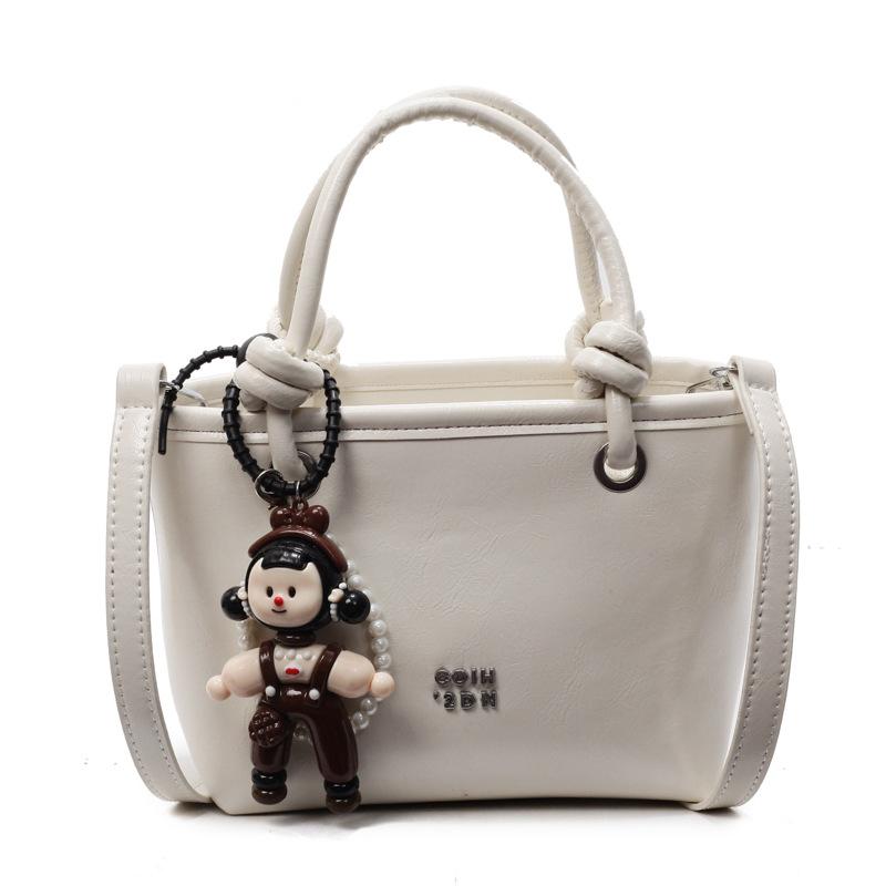 2025 new Korean simple oil wax leather portable bucket bag fashionable versatile solid color foreign style commuter messenger women's bag