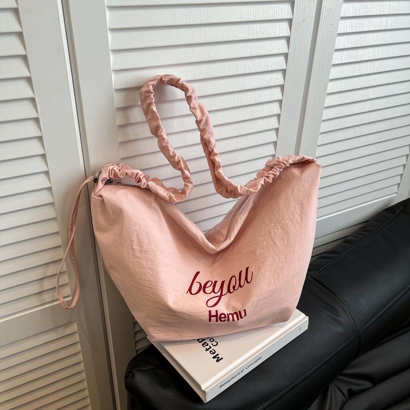 Large-capacity niche design personalized bag women's 2025 fashion commuter dumpling bag Korean simple single shoulder oblique span bag