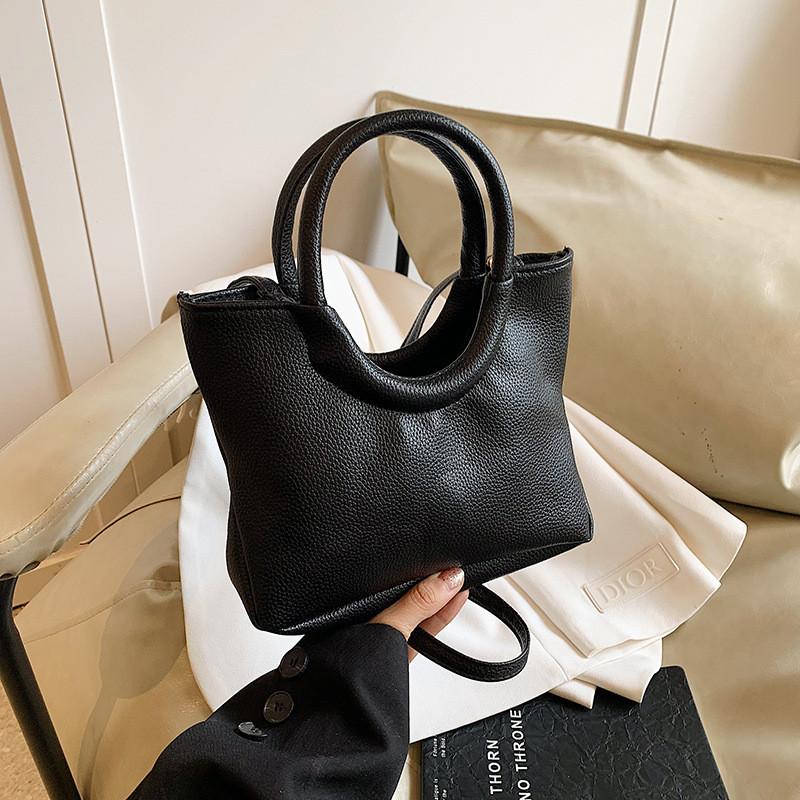 Urban Minimalist Creative Round Handheld Bag Large Capacity Tote Bag In Chic Brown Khaki White And Black Colors For Everyday Use
