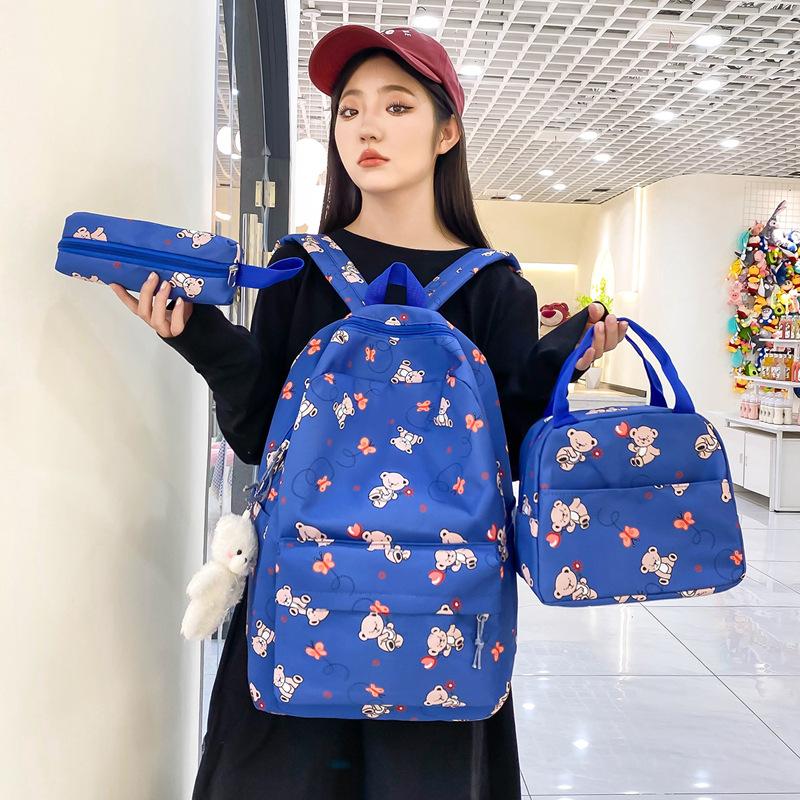 School bag new cute cartoon nylon backpack women's large-capacity middle and high school burden reduction wear-resistant school bag three-piece set