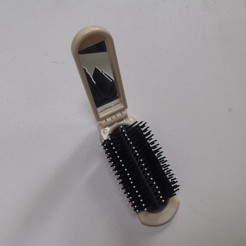 

Portable 2-in-1 Folding Mirror Comb: Compact Mini Comb with Cushion, Integrated Massage Features, and Cute Design.