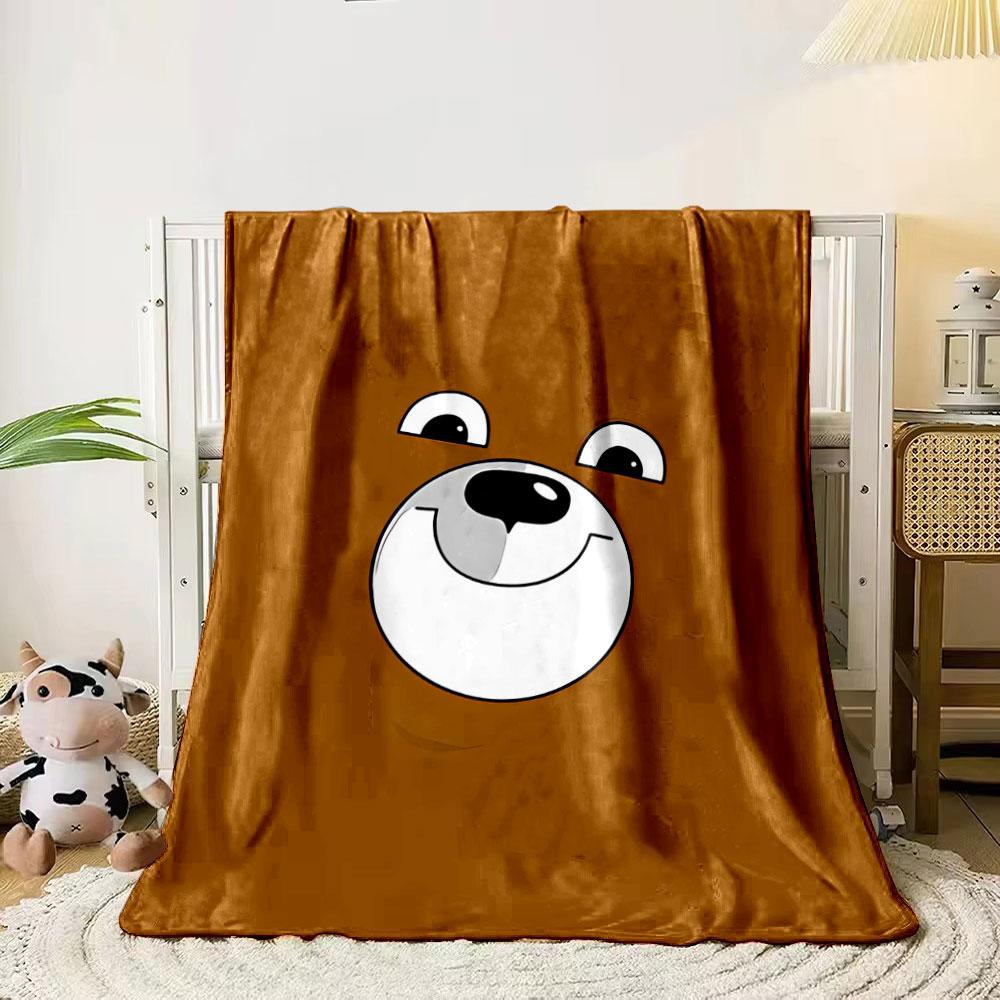 A smiling cartoon bear face on a brown background. for all seasons blanket lunch break throw gift 80cm x 120cm