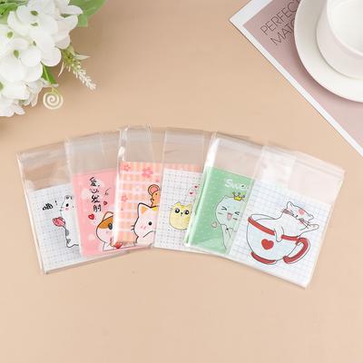 100 יחידות שקיות אריזה לעוגיות חתול מצויר, שקיות ממתקים למתנות, שקיות פלסטיק דביקות עצמית לאריזת עוגיות, שקיות מתנות לחטיפים