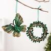 Green and Gold Hanging Christmas Decorations with Varied Holiday Motifs, Frosted Finish, and Integrated Ribbons for Seasonal Arrangements