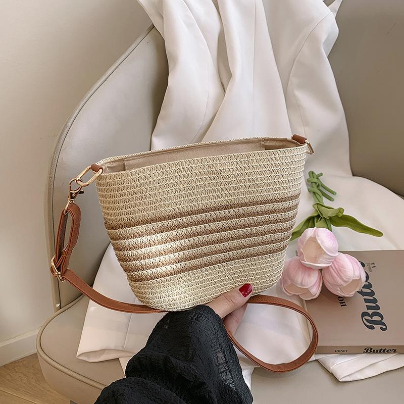 

Летняя популярная соломенная плетеная сумка для женщин, новый стиль пляжного отпуска, плетеная сумка, повседневная универсальная сумка-ведро через плечо