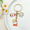 Elegant Christmas Keychain: Gold Snowflake & Snowman Pendant