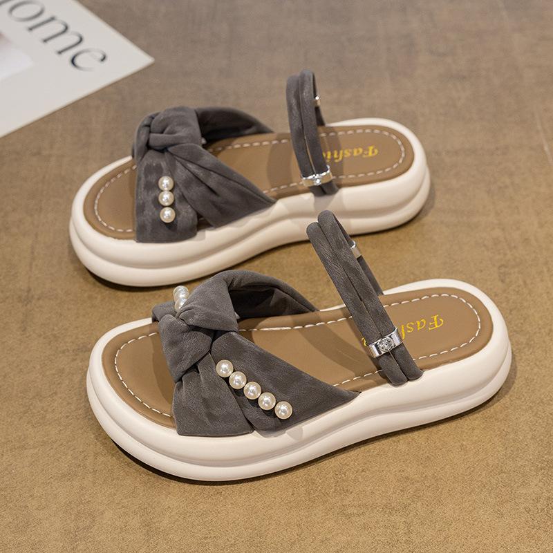 Thick-bottomed cool slippers female 2025 summer new fairy wind outside wear Internet celebrity versatile pearl bow word slippers