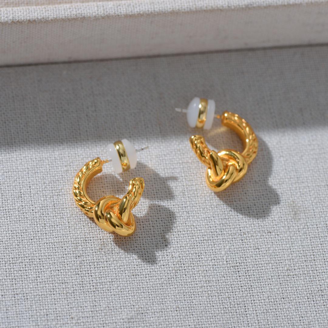 

French Metal Knot Earrings with S925 Silver Needle, European & American Light Luxury Design, High-Class Temperament Studs.