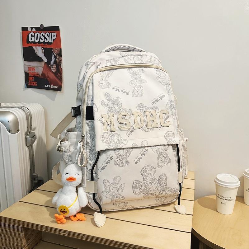 School bag for female junior high school students, simple and versatile printed bear niche design 2025 new college student computer backpack for men
