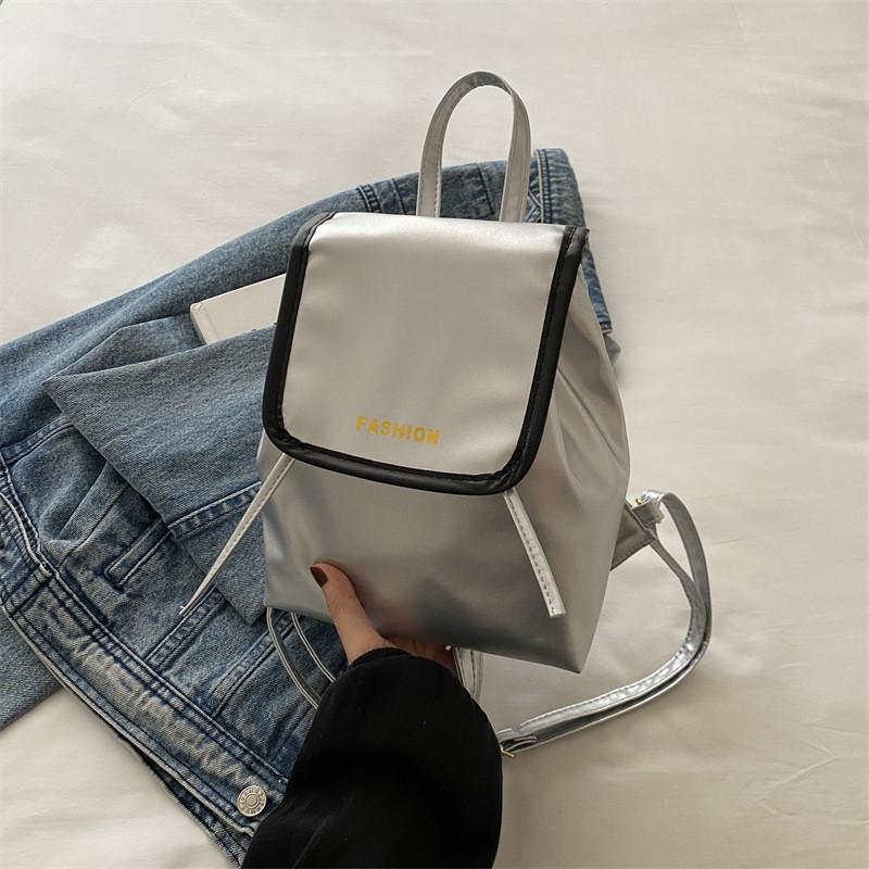 

Stylish Minimalist Backpack For Students And Travelers In Black Pink And Silver With Magnetic Closure срібний