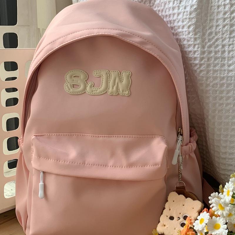 Simple high-value schoolbag, junior high school college student solid color niche simple campus style backpack travel commuter backpack розовый