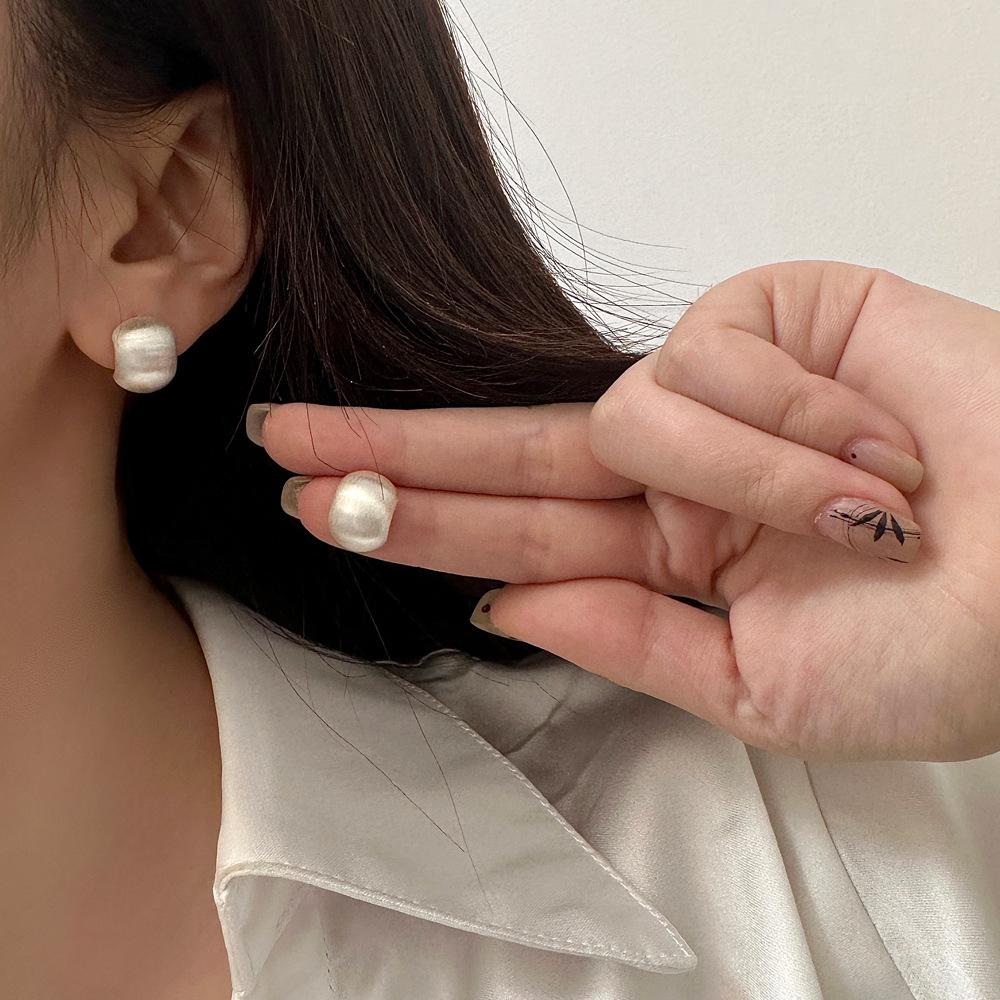 Elegant European & American Style Brushed 925 Silver Stud Earrings: Light Luxury, Versatile, and Fashionable Flat Round Design.