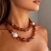 Stylish Red Resin Irregular Bead Necklace With Adjustable Length For Personalized Fit And Artistic Design In Sturdy Alloy Construction.