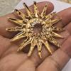 Stylish Matte Gold Sun Brooch for Women: European & American Niche Design Windbreaker Accessory