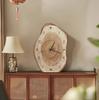 Clock with an irregular wood grain pattern; silent operation. Suitable as living room decor or as a tabletop clock (battery included).
